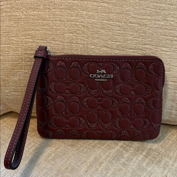 Coach Handbags - Coach Maroon Poppy Embossed Wristlet
